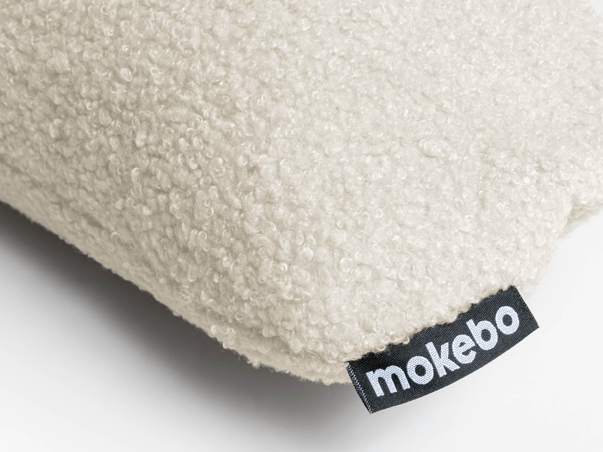 Nahaufnahme Bouclé Stoff in hellbeige und mokebo Batch