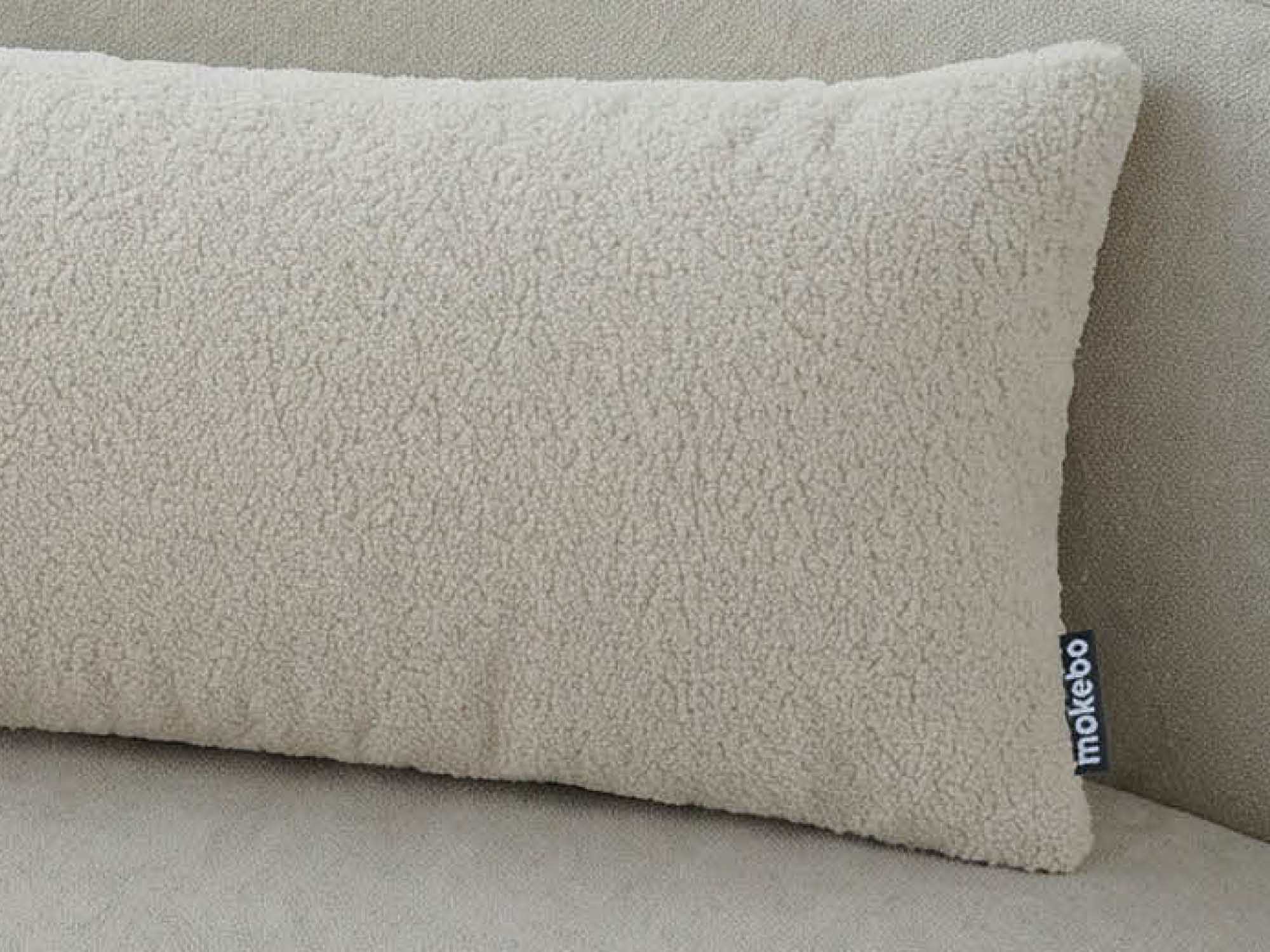 mokebo Lendenkissen beige bouclé auf Sofa